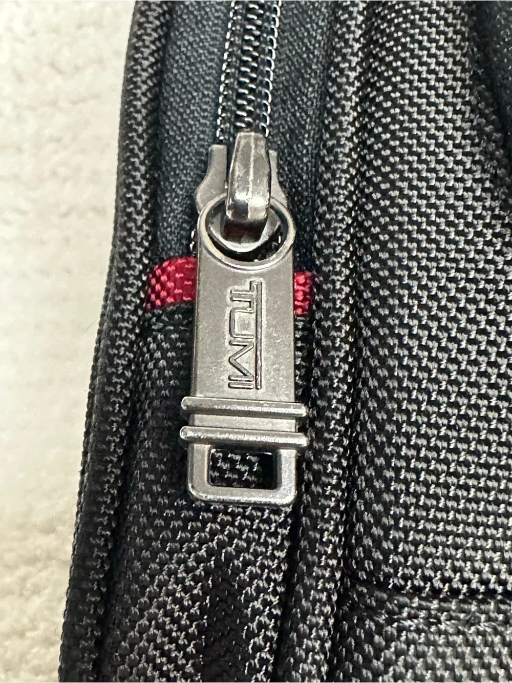 Tumi Black Toiletry Bag with Red Accents